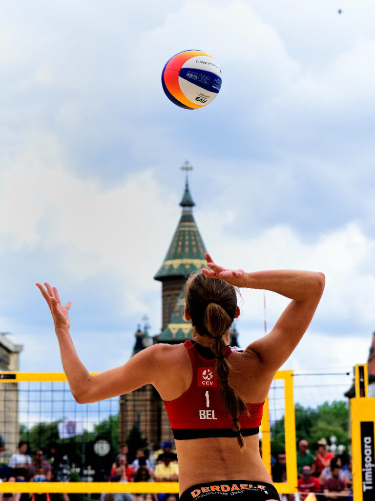 A beachvolley girl serving in Timisoara