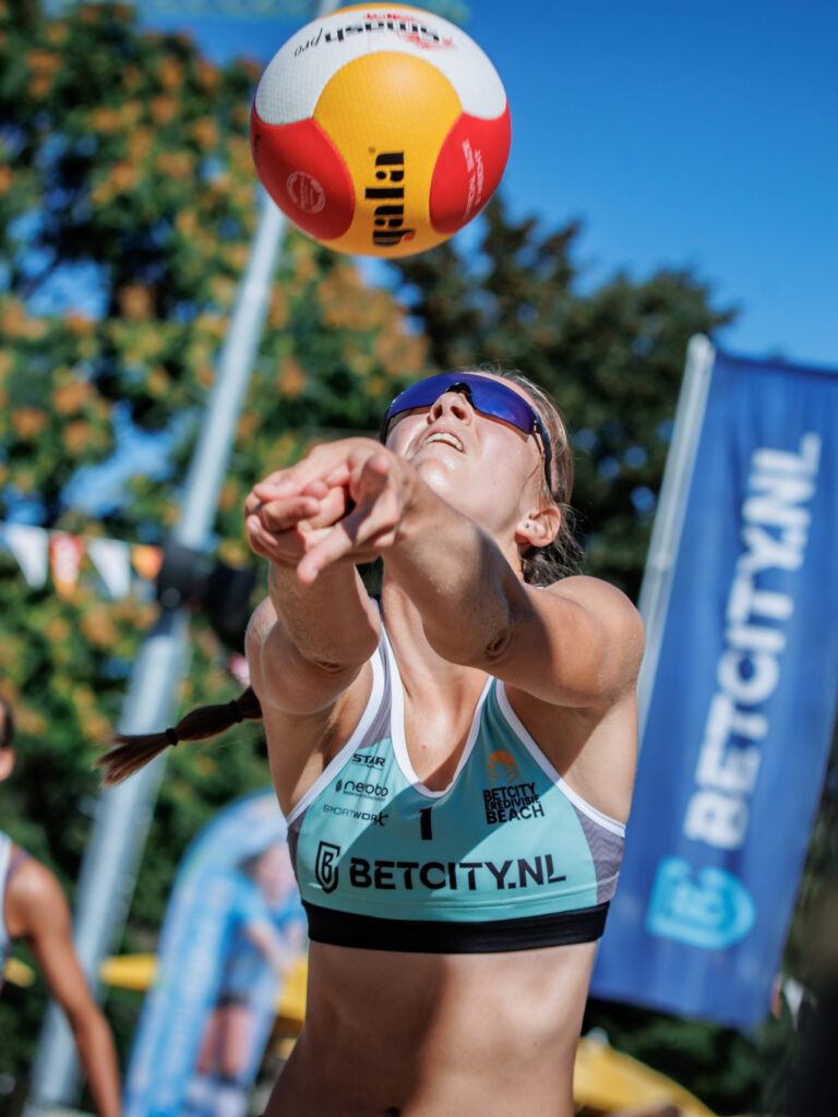 A beachvolley girl setting at the Queen of the court in Tilburg.